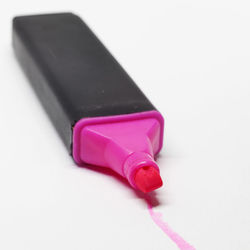 Close-up of pink object over white background