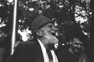 Portrait of smiling man looking away outdoors