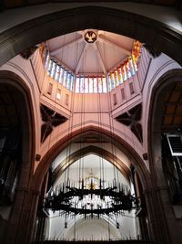 Low angle view of stained glass window in building