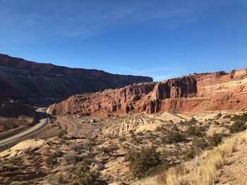 Scenic view of landscape against blue sky