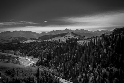 Panoramic view of landscape against cloudy sky