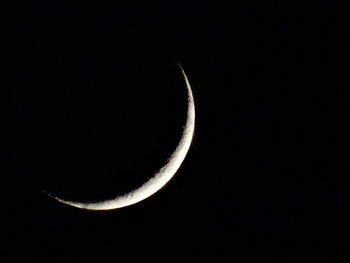 Low angle view of moon against sky at night