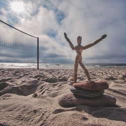 Man on beach against sky