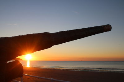 Scenic view of sea against orange sky