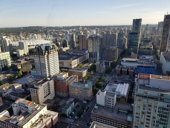 High angle view of modern buildings in city against sky