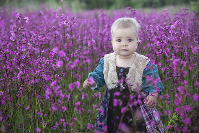 Adorable child in a flower field