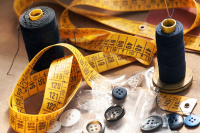 Close-up sewing items on table