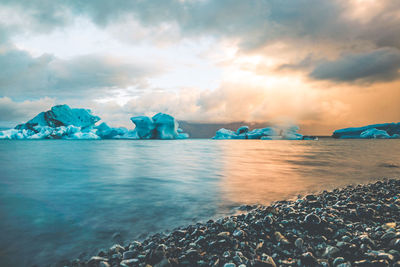 Scenic view of sea against sky during winter