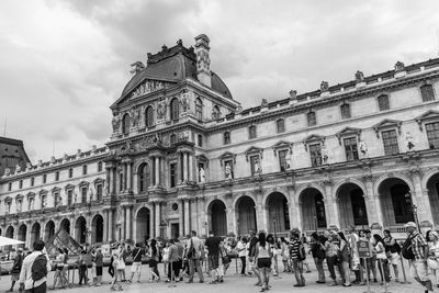 Low angle view of historical building against cloudy sky