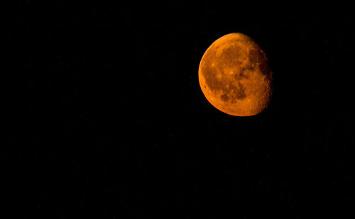 Low angle view of moon against clear sky at night