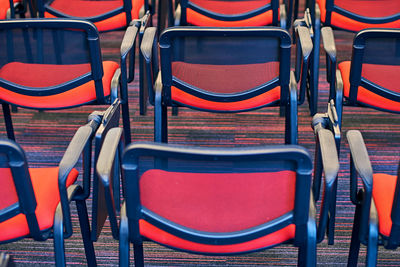 Empty chairs in amusement park