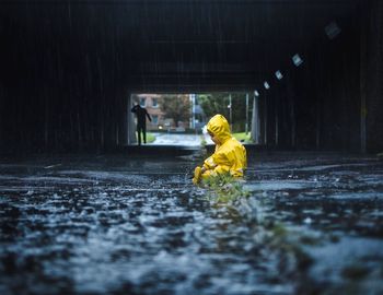 Man working in puddle