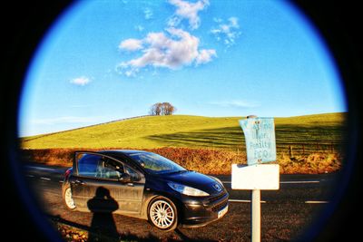 Close-up of car against sky