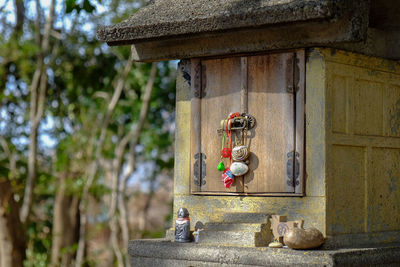 Close-up of jizo statue on built structure