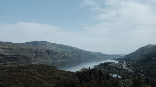 Scenic view of landscape and mountains against sky