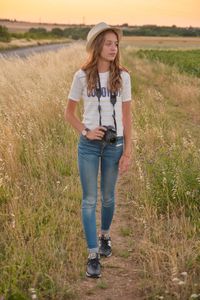 Young woman standing on field