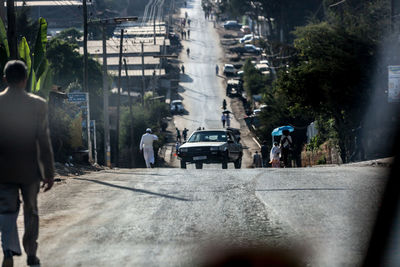 People on road in city