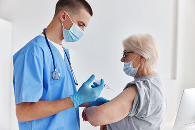 Female doctor examining patient in hospital