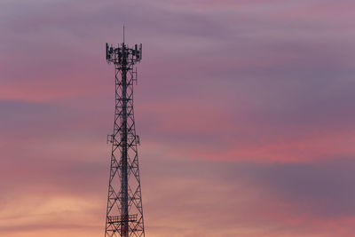 Telephone tower on evening cloud and twilight sky background.