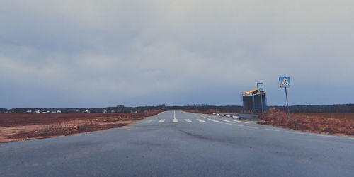 Empty road against sky