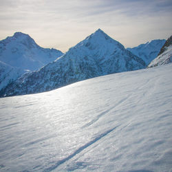 Scenic view of snowcapped mountains against sky