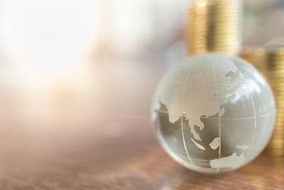 Close-up of glass ball on table