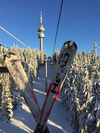Low angle view of cross against sky