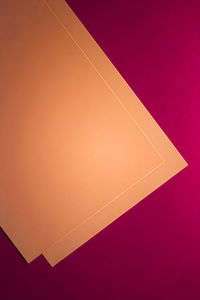 High angle view of paper against orange sky
