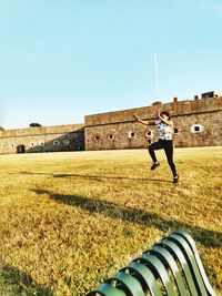 Man on field against clear sky