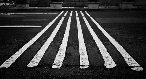 Close-up of zebra crossing on road