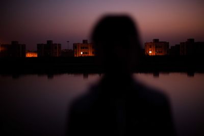 Silhouette of city skyline at night