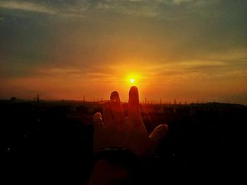 Silhouette of city at sunset