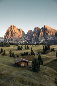 Scenic view of landscape and mountains against clear sky