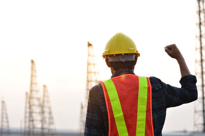 Rear view of man working at construction site