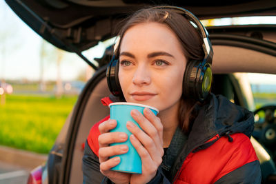 Young woman drinking coffee