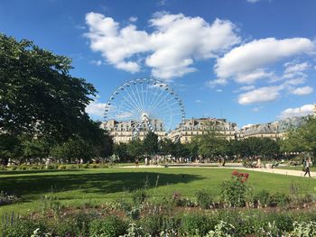 Ferris wheel in park against sky