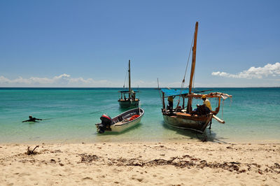 View of boats in sea against sky