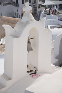 Close-up of white and tables against building