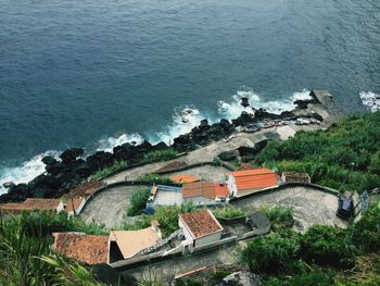 High angle view of houses by sea