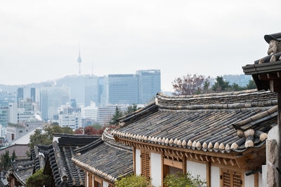 Buildings in city against sky