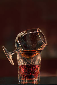 Close-up of drink in glass against black background