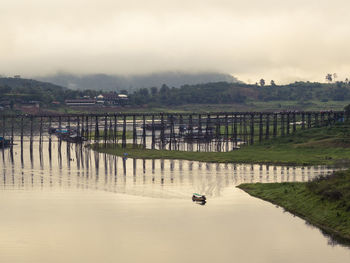 Bridge over river against sky