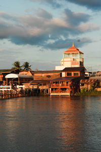 Building by sea against sky