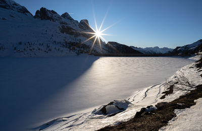 Scenic view of snowcapped mountains against sky