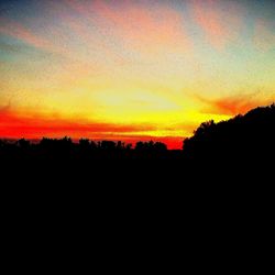 Scenic view of silhouette landscape against sky during sunset