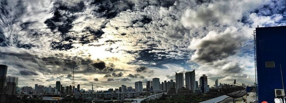 building exterior, city, architecture, sky, built structure, cloud - sky, cityscape, skyscraper, cloudy, urban skyline, cloud, tall - high, modern, office building, weather, skyline, city life, tower, storm cloud, overcast