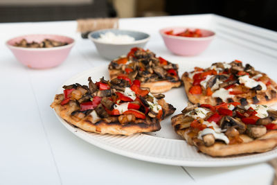 Pizzas in plate on table