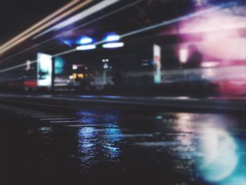 Reflection of illuminated lights on railroad track