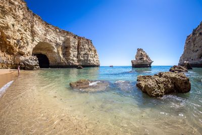 Scenic view of sea against clear blue sky