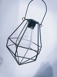 Low angle view of light bulb hanging on mountain